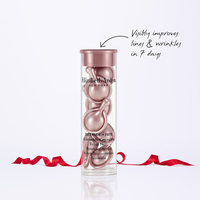 Retinol + HPR Capsules Serum which "Visibly improves lines & wrinkles in 7 days" with a red ribbon on a white background