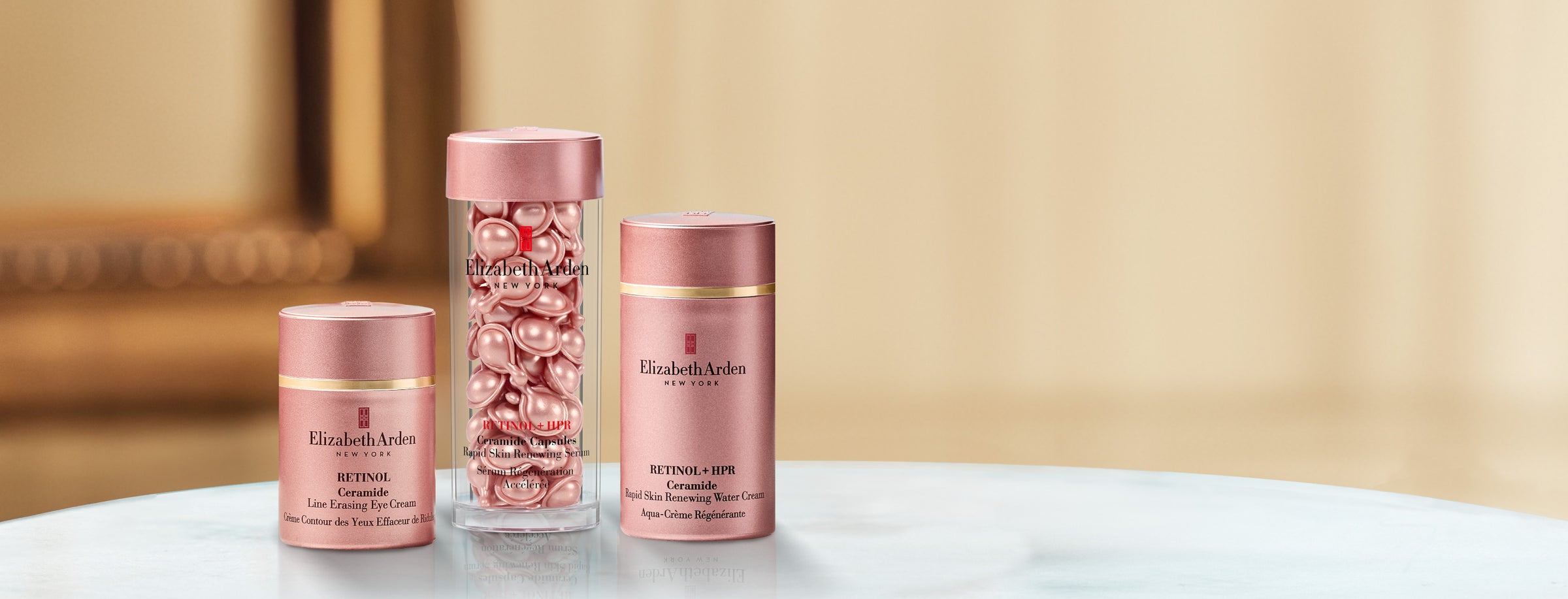 Collection of Elizabeth Arden Retinol skincare products on a blurred beige background