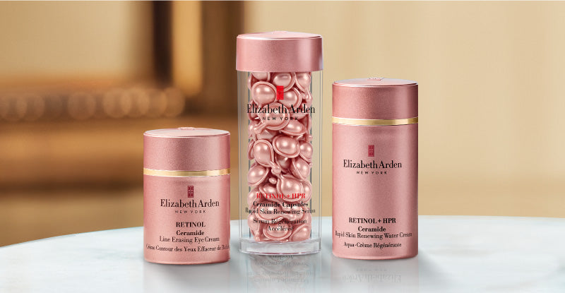 Collection of Elizabeth Arden Retinol skincare products on a blurred beige background