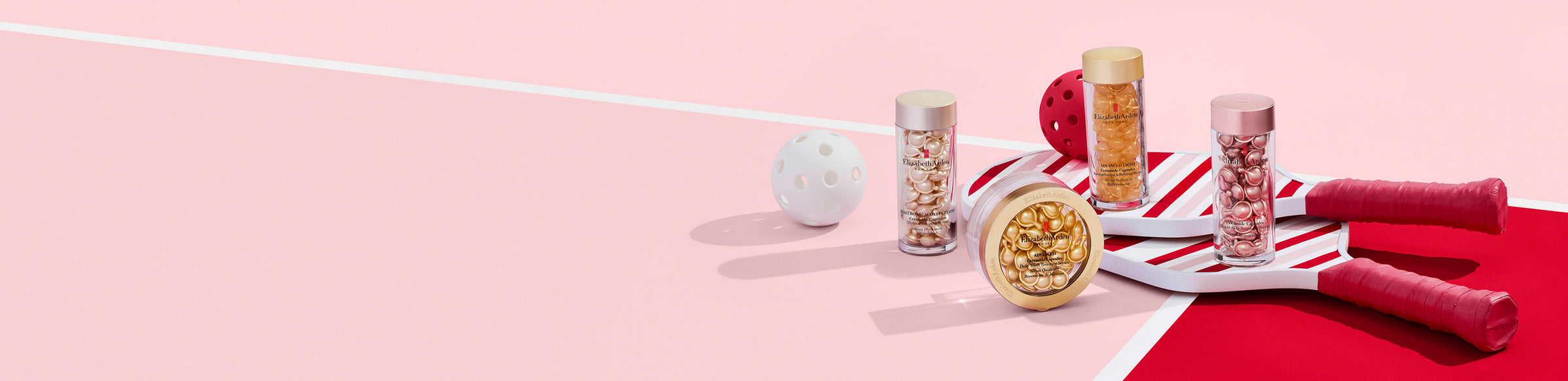 Elizabeth Arden Capsule Serum products on a pink and red background with pickleball paddles and balls.
