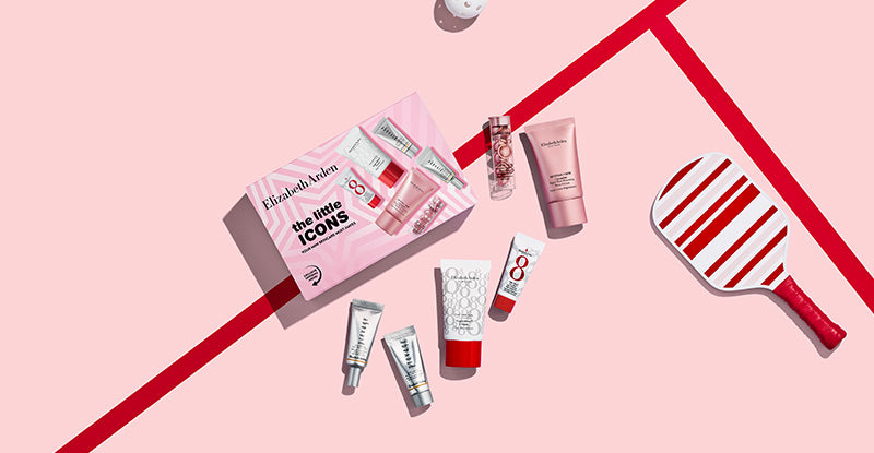 Elizabeth Arden skincare set laid flat on a   on a pink and red background next to a stripe pickleball paddle and ball