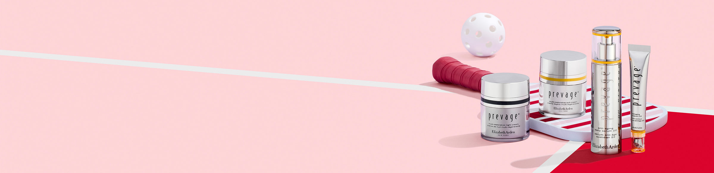 Collection of Prevage skincare products on a stripe pickleball paddle on a pink and red background next to a call