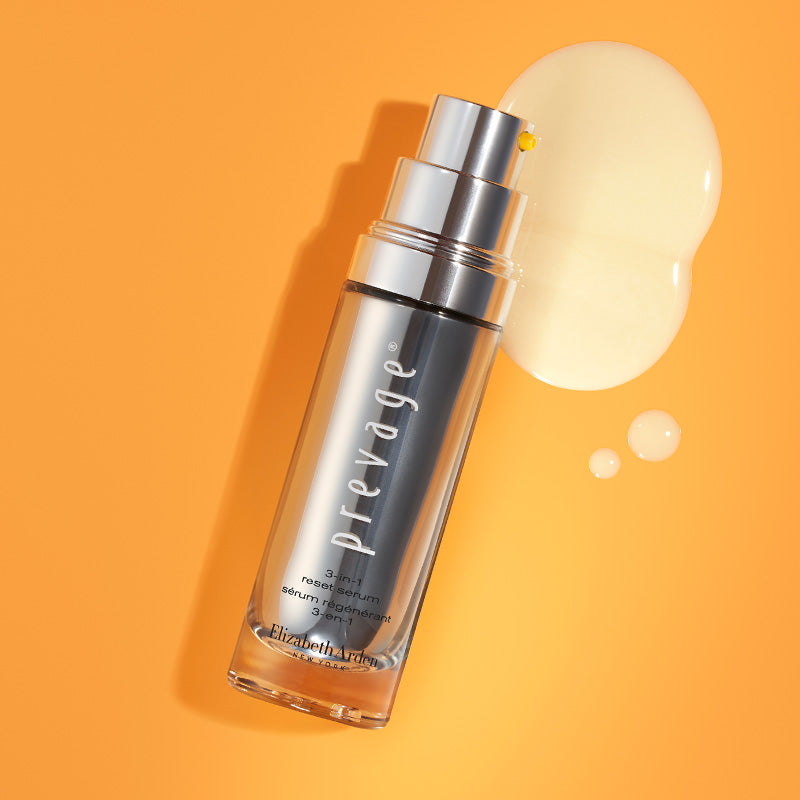 Skincare serum bottle with a droplet of product on an orange background