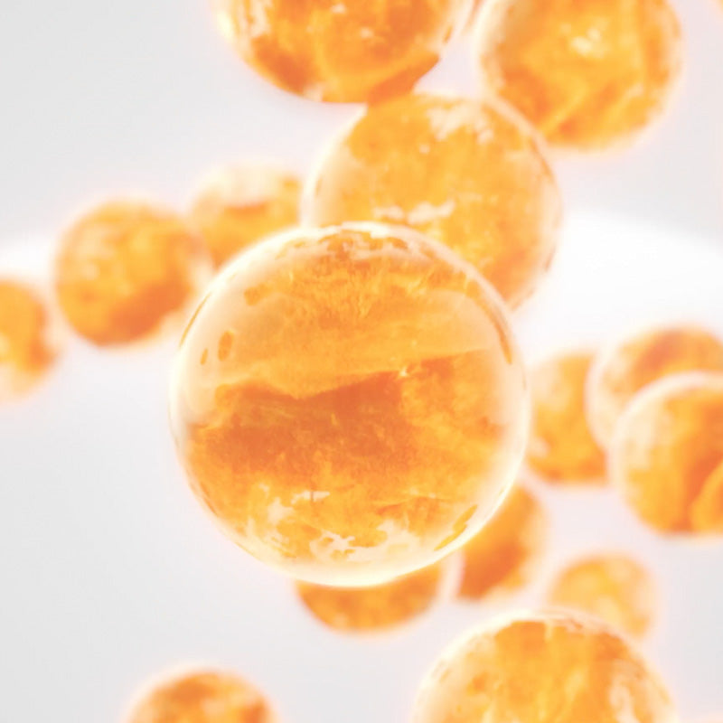 Close-up of orange spherical objects on a white background