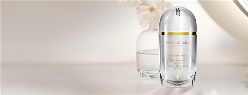 Superstart Skin Renewal Booster on a neutral background with flowers.