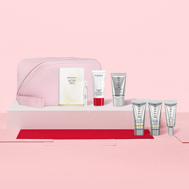 Cosmetic set with skincare products on a pink background