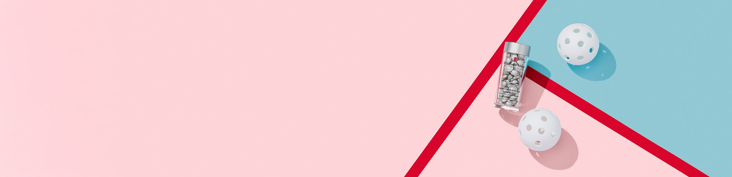Two white balls next to Visible Brightening Clearly Radiant Spot Correcting Capsules on a pink and blue geometric background
