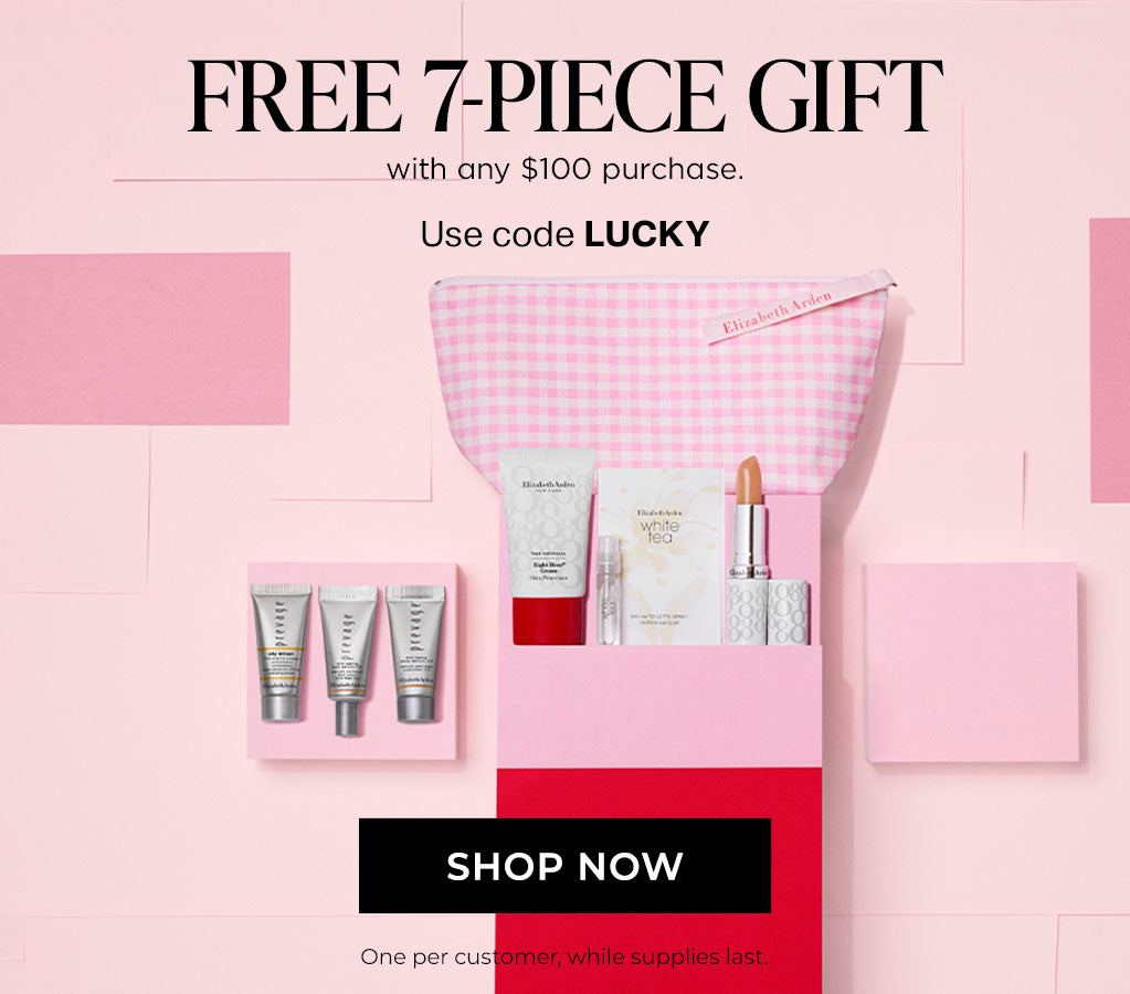 Promotional image of a free 7-piece gift with a $100 purchase, featuring a pink and red gift set on a light pink background.