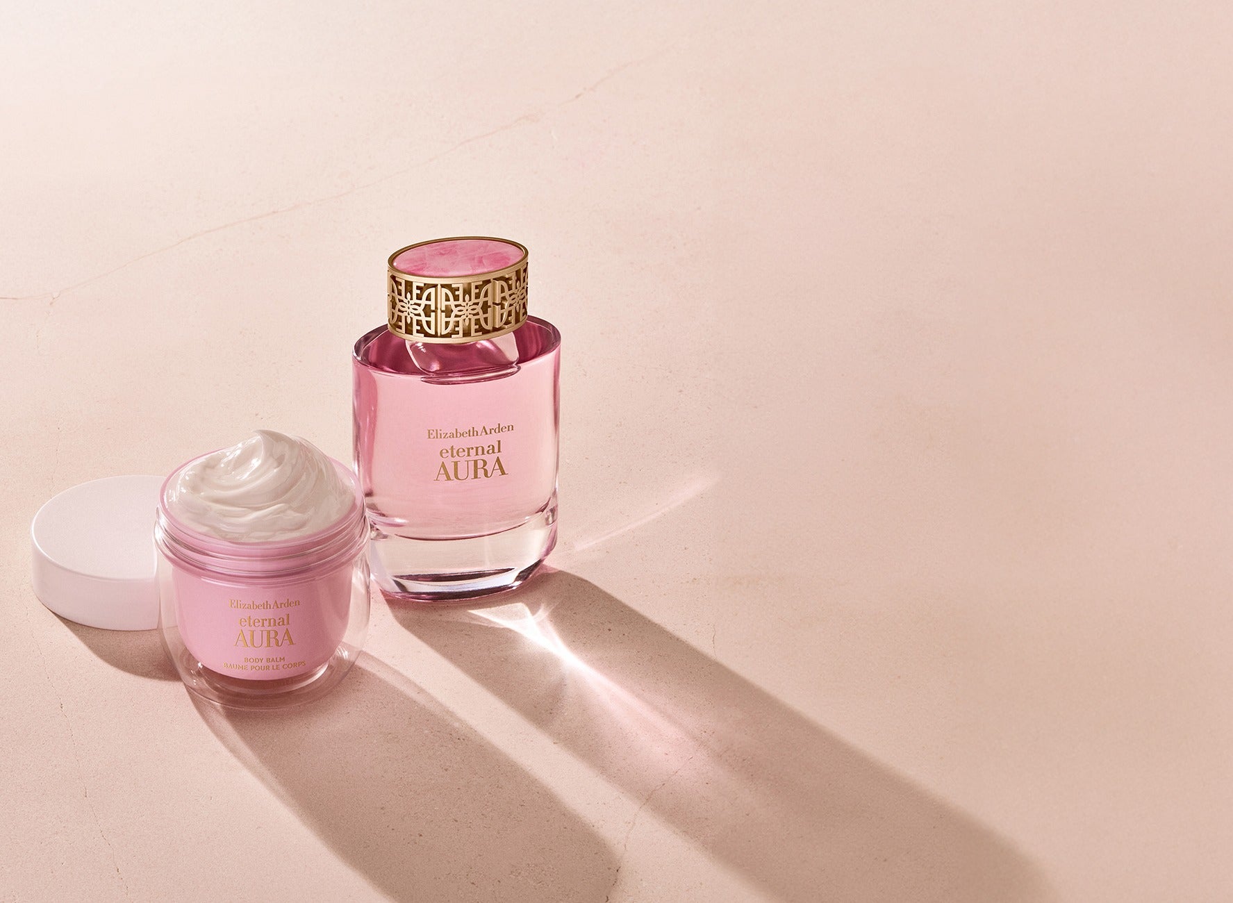 Elizabeth Arden Eternal Aura perfume and body balm on a light background