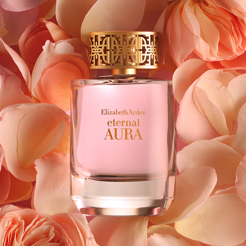 Elizabeth Arden Eternal Aura perfume bottle surrounded by pink flowers