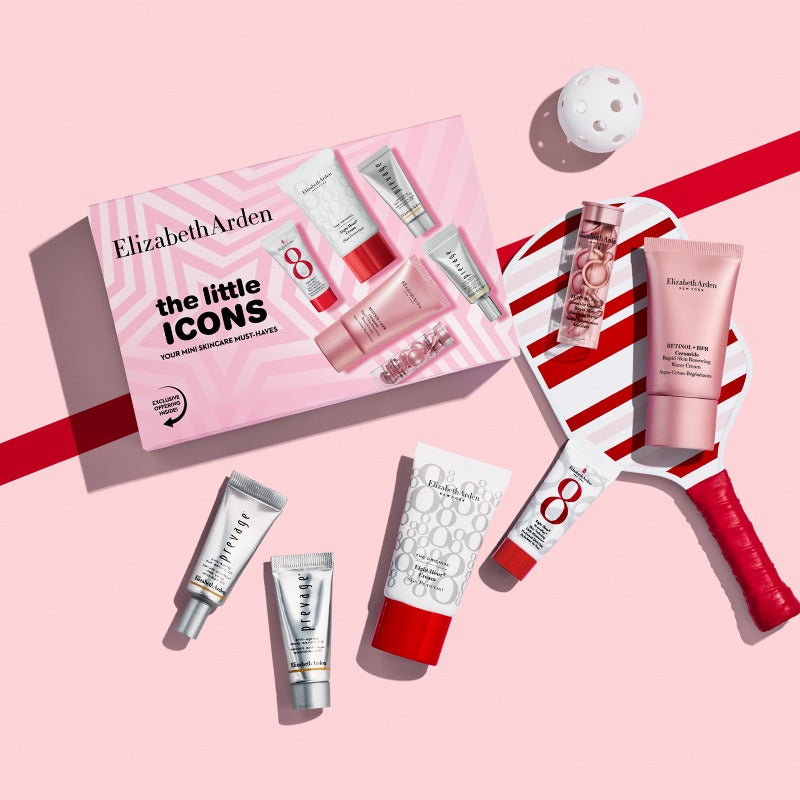 Elizabeth Arden skincare set with pink and white packaging on a pink background next to a pickle ball paddle and ball