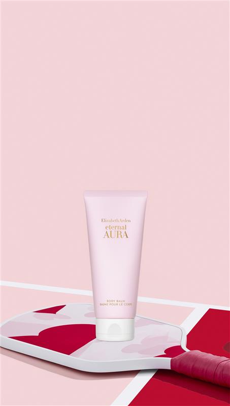 Pink tube of Elizabeth Arden cream on a pink and red abstract background