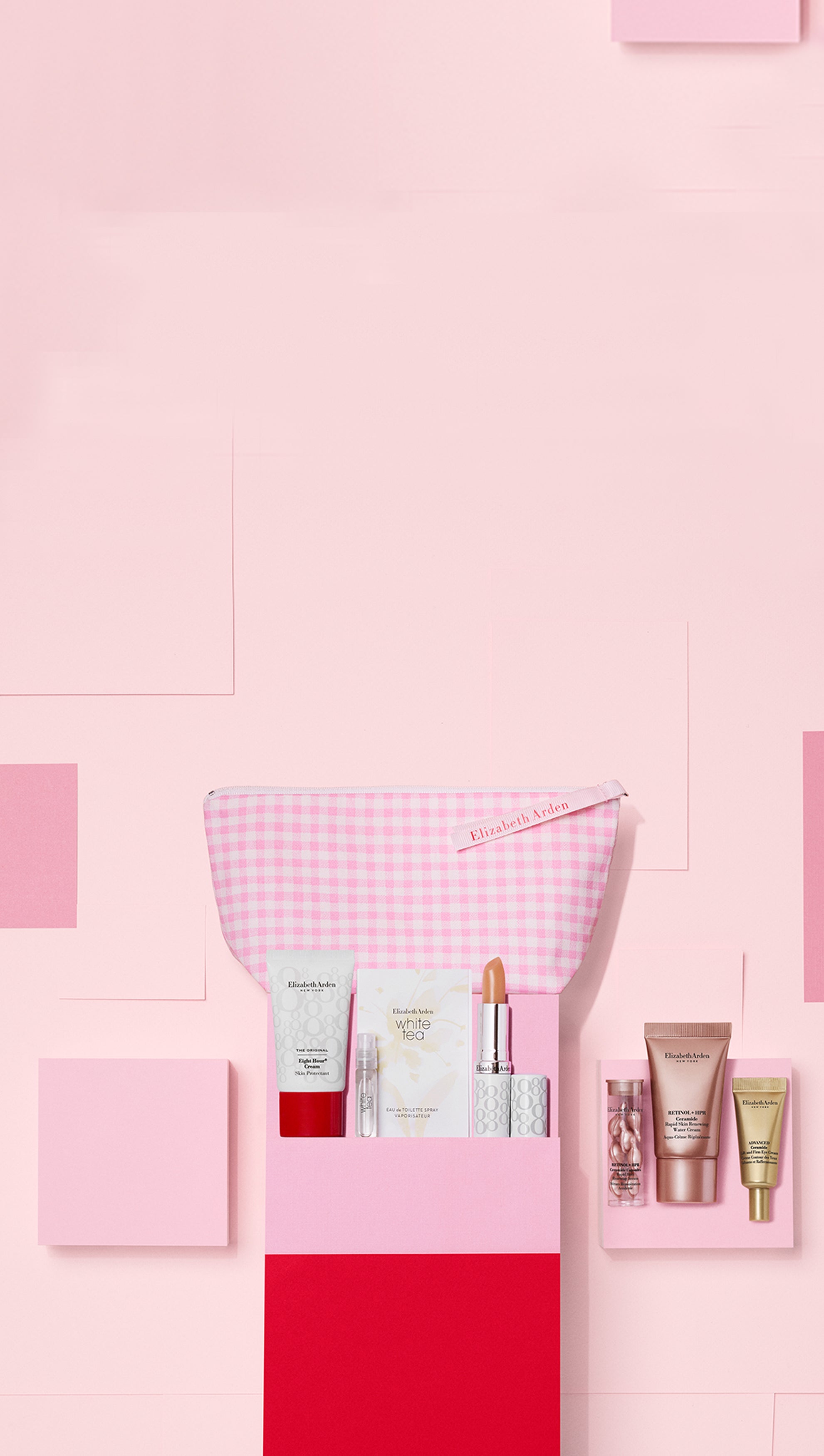 visual of a 7-piece sample gift set on a pink checkered background
