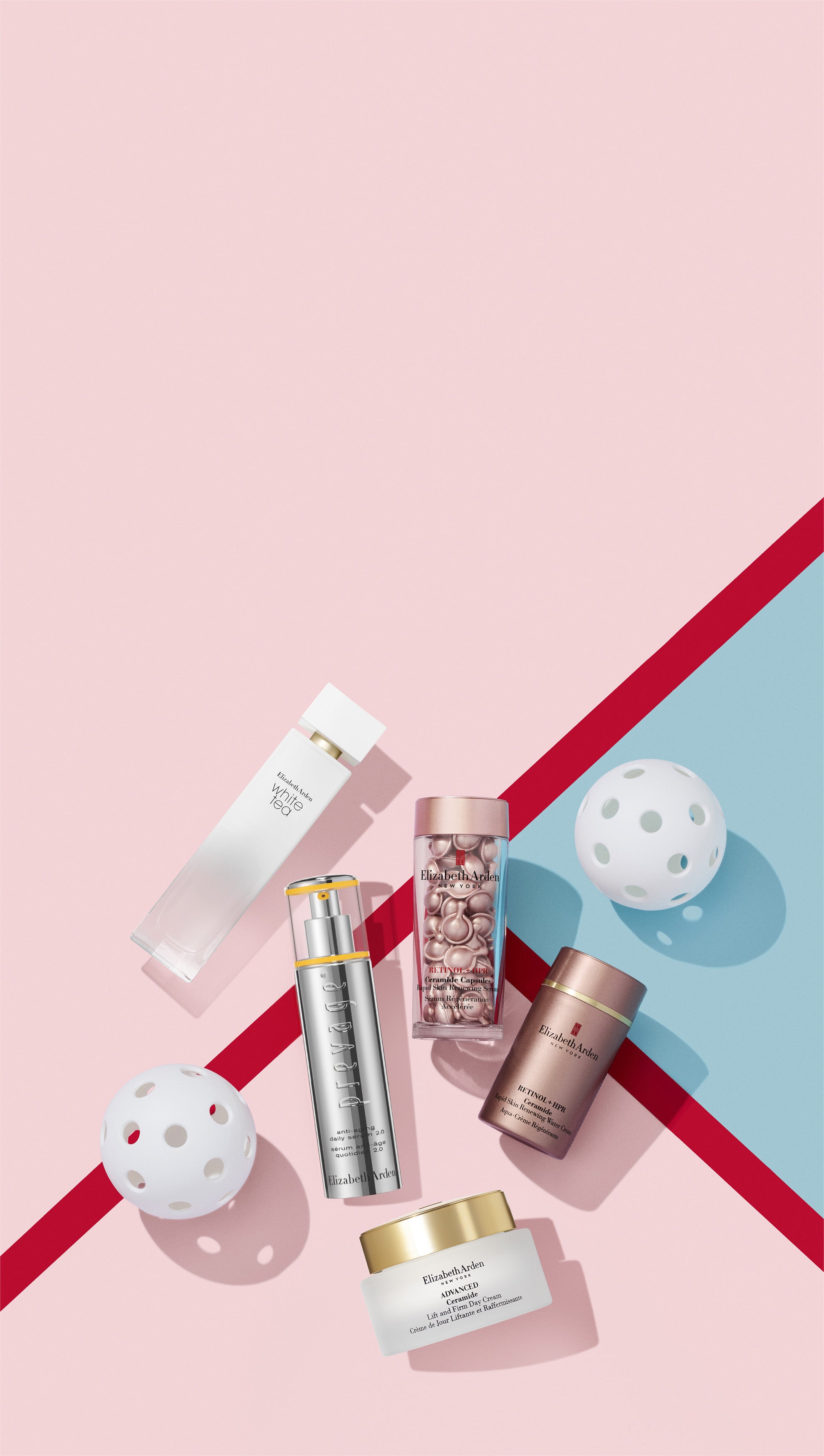 Collection of skincare products on a pink and blue geometric background