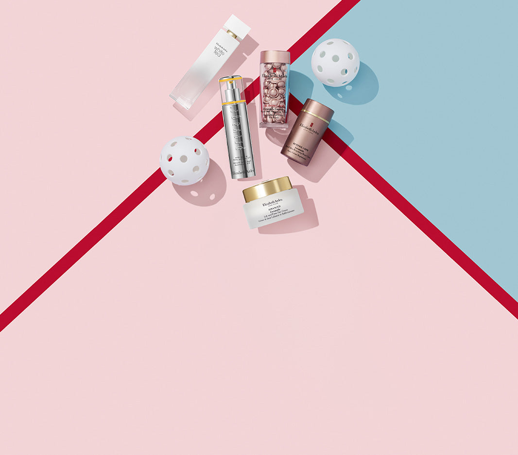 Collection of skincare products on a pink and blue geometric background