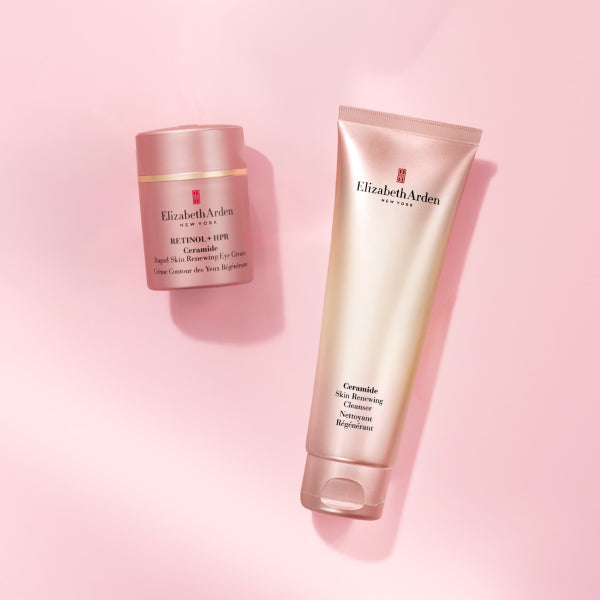 Elizabeth Arden Ceramide eye cream and cleanser skincare products on a pink background