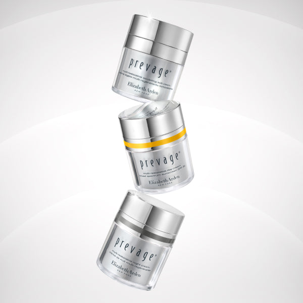 Three jars of Prevage skincare product by Elizabeth Arden on a light gray background