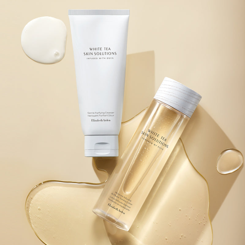 White Tea Skin Solutions skincare products on a beige background