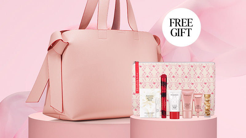 Pink tote bag with cosmetic products and a free gift offer on a pink background