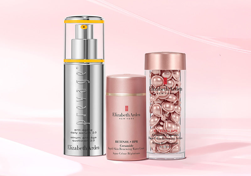 Three Elizabeth Arden skincare products for lines, wrinkles, anti-aging on a pink background.