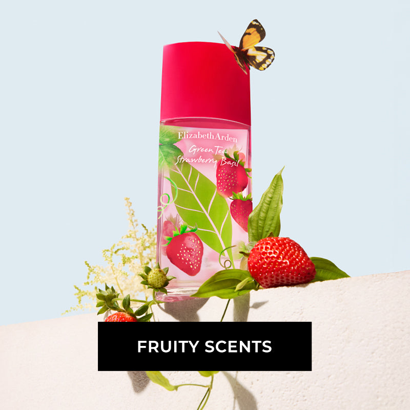 Elizabeth Arden Green Tea Strawberry Basil sitting on beige wall on a blue background surrounded by vines, leaves and strawberries with a butterfly sitting on the cap. The CTA reads "FRUITY SCENTS"
