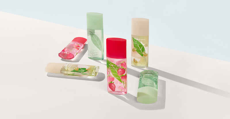 Set of fragrances from the Green Tea collection on a blue and white background