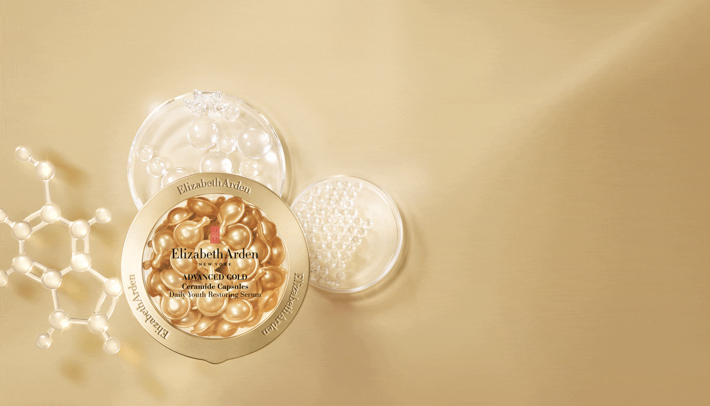 Animation showing light glistening from the new Advanced Gold Ceramide Capsules Serum which sits on top of molecule ingredients on top of a gold background. 