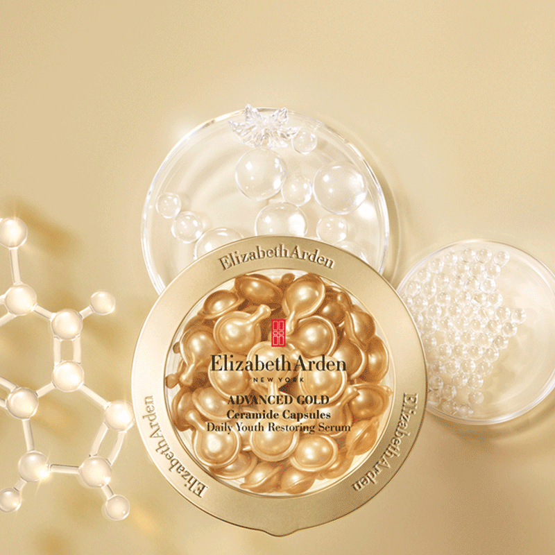 Animation showing light glistening from the new Advanced Gold Ceramide Capsules Serum which sits on top of molecule ingredients on top of a gold background. 