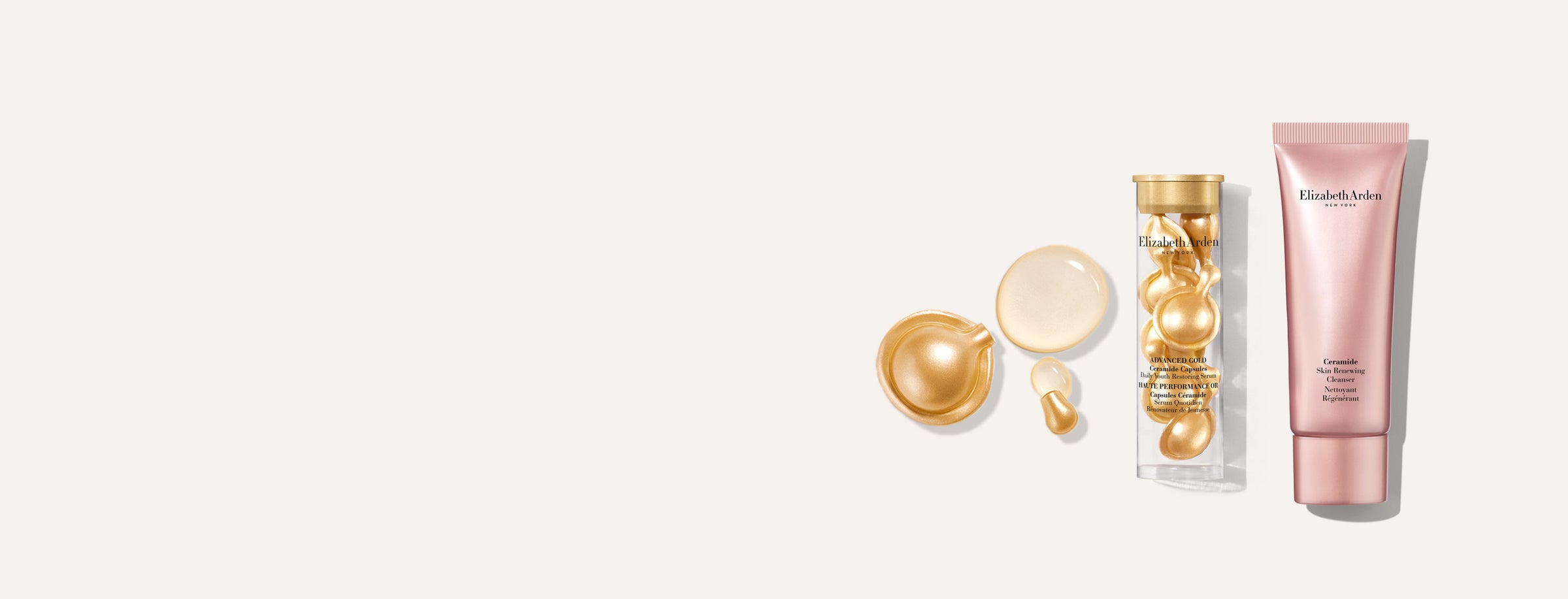 Elizabeth Arden free 2-piece gift featuring a mini Advanced Gold Ceramide Capsules Serum with a gold capsules spilling to show liquid texture of the serum and a mini Ceramide Skin Renewing Ceramide Cleanser — displayed on a light beige background.