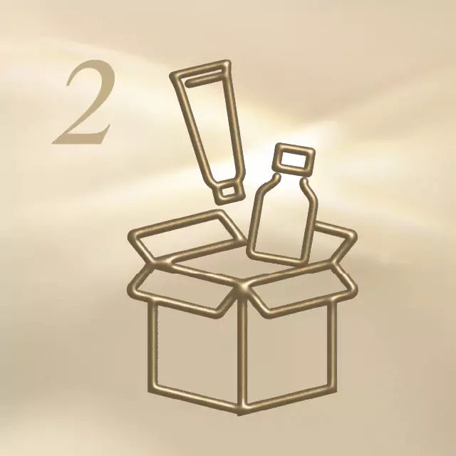 Gold wire art of a box with a bottle and exclamation mark on a beige background