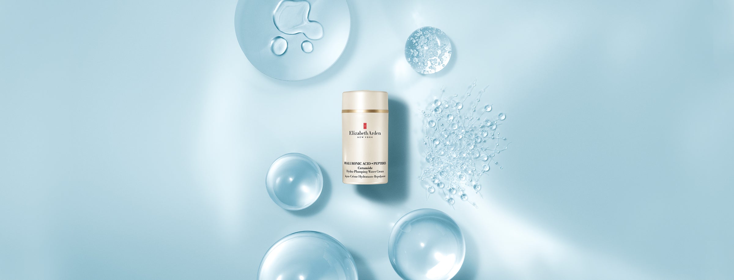 Hyaluronic Acid + Peptides Water Cream with ingredients surrounding it with a blue background