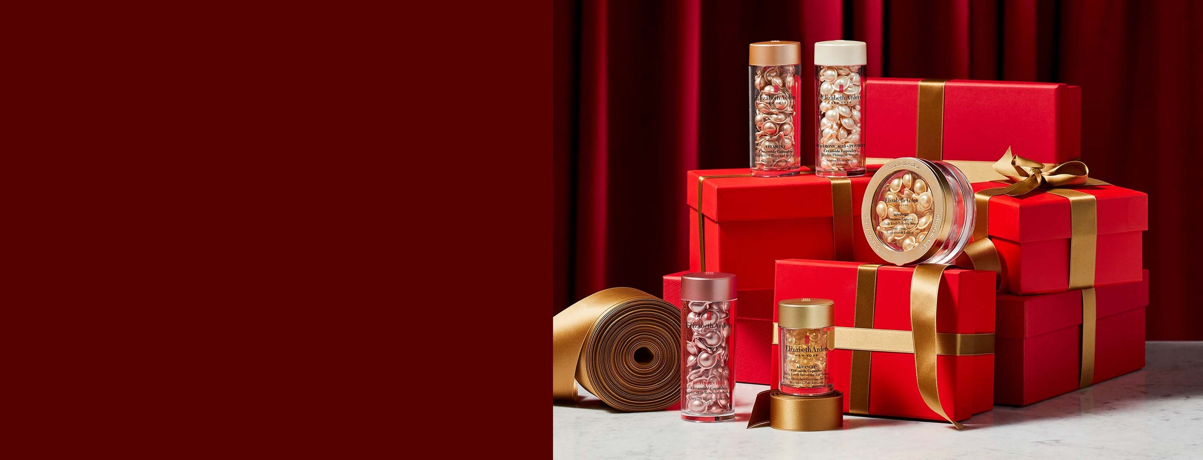 Red gift boxes with gold ribbons and decorative items on a red background with Ceramide Capsules