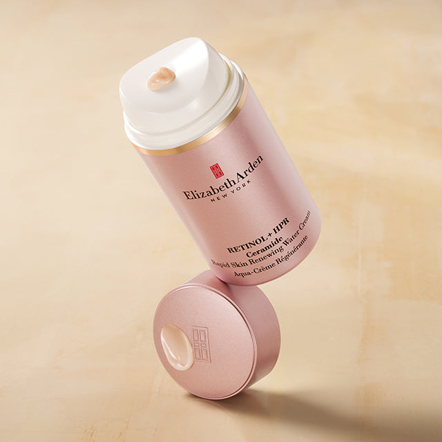 Retinol + HPR Ceramide Water Cream balancing on top of cap with yellow beige background. Mobile Version. 
